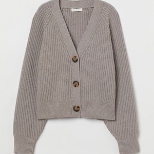 Relaxed-fit cardigan in soft, rib-knit fabric with wool content. V-